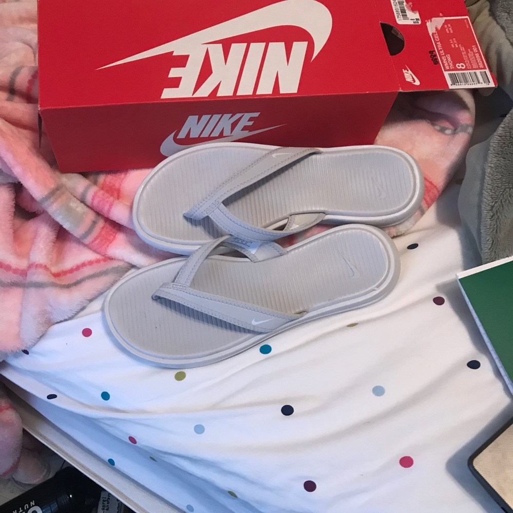 Brand new grey Nike flip flop